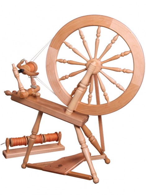This is my wheel, plus the "lazy kate" to hold the bobbins for plying.